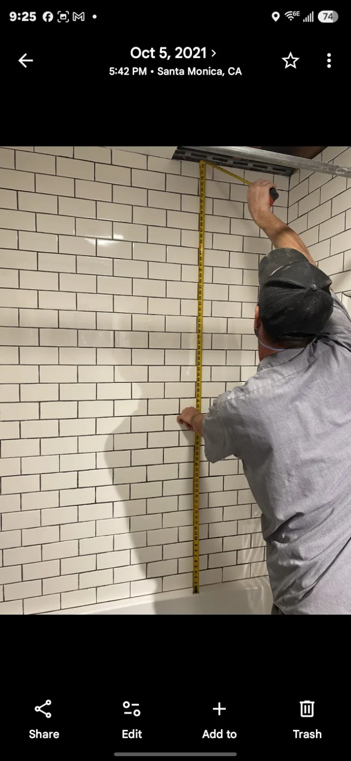 Measuring tile wall during project work